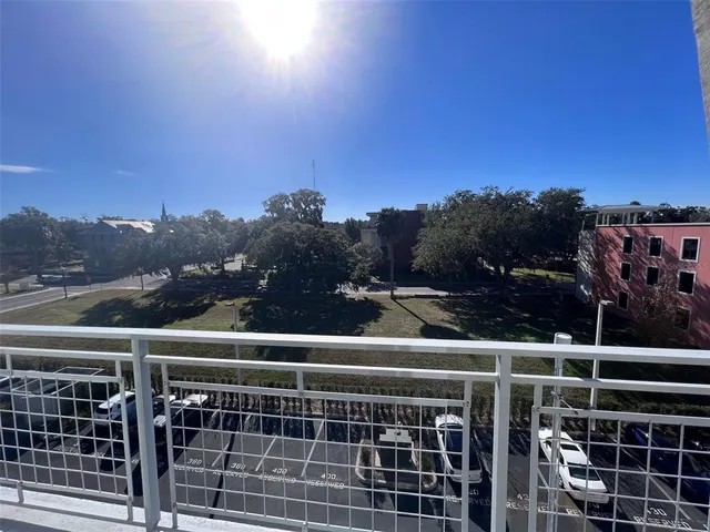 a view of a balcony with a floor to ceiling window