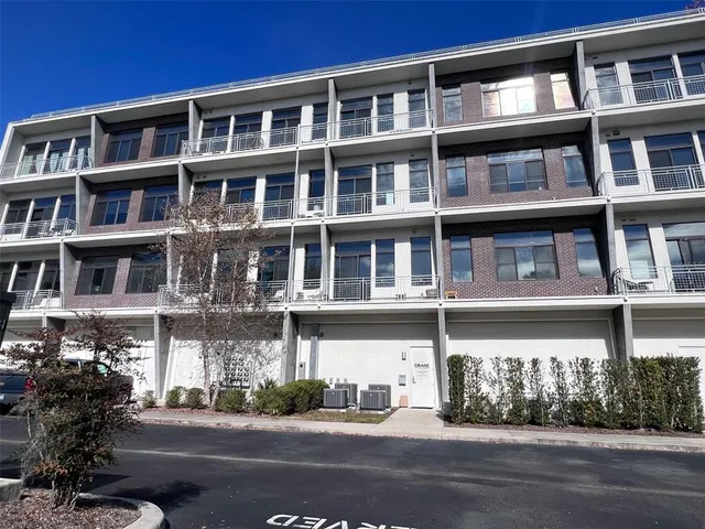 a front view of a building with lot of windows