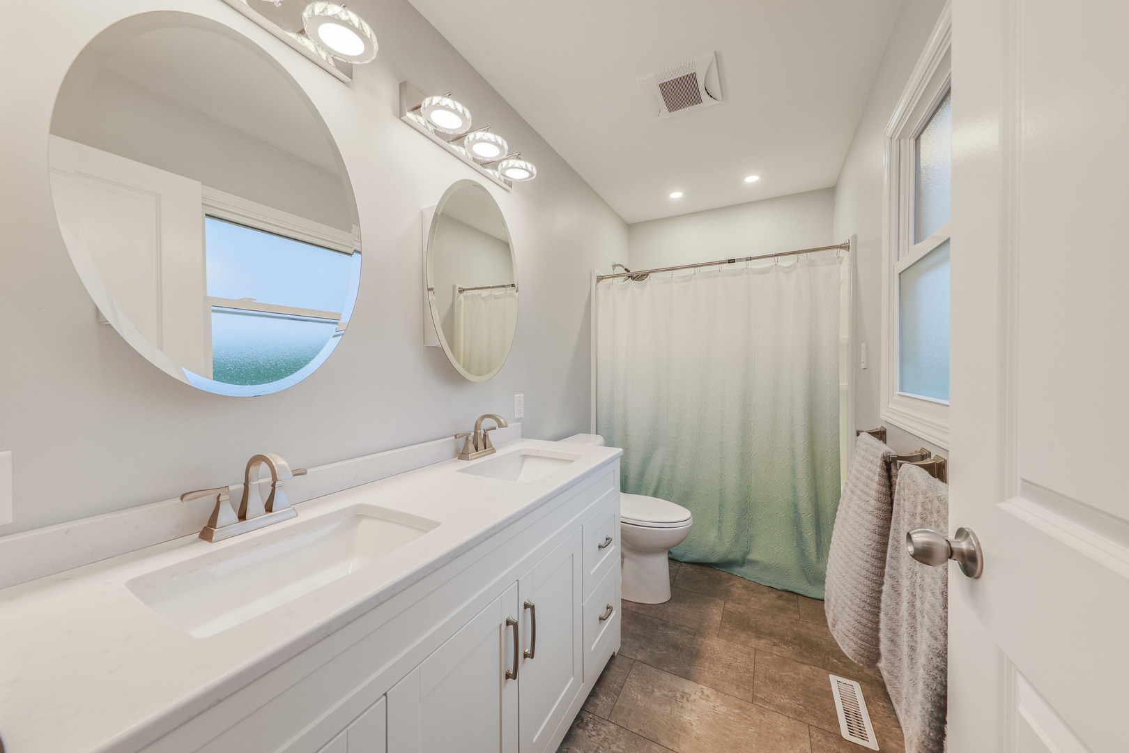 2433 East 2850th Road Marseilles, IL 61341 - Photo 12 of 20 a bathroom with a double vanity sink mirror and toilet