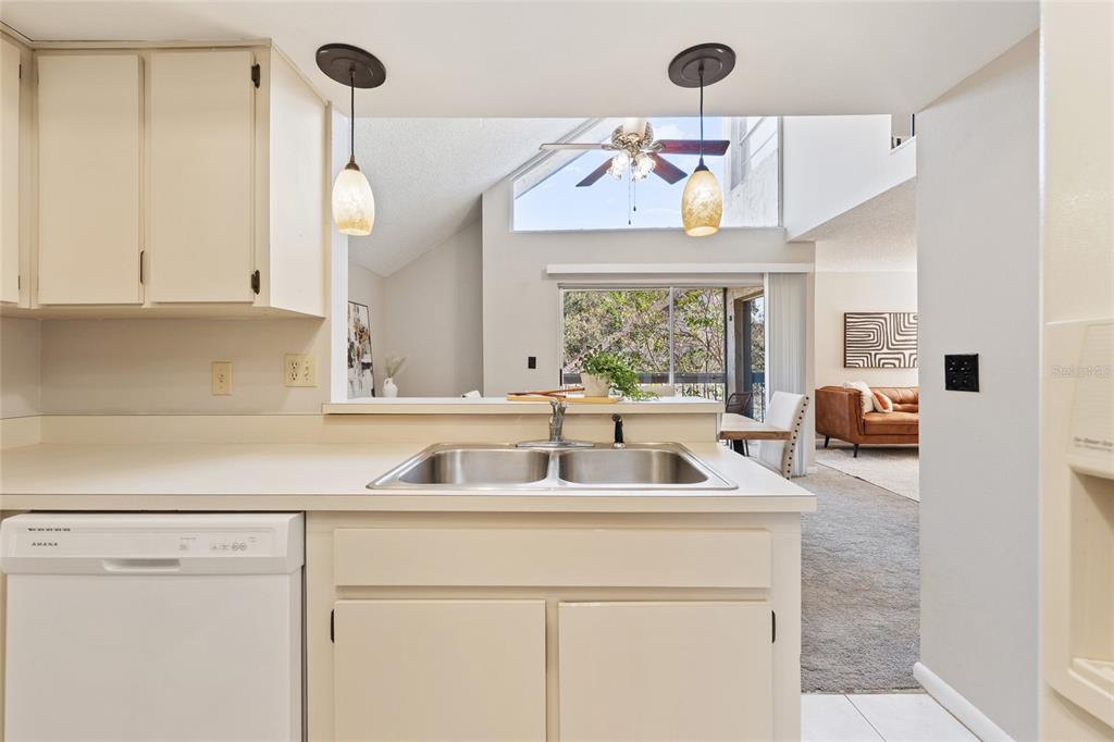2025 Sylvester Road, Unit N312 Lakeland, FL 33803 - Photo 13 of 35 a kitchen with a sink a counter space and windows