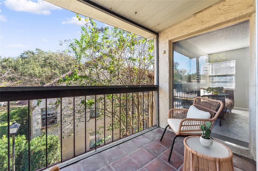 2025 Sylvester Road, Unit N312 Lakeland, FL 33803 - Photo 17 of 35 a room with a large window and chairs