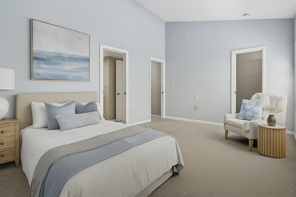 2025 Sylvester Road, Unit N312 Lakeland, FL 33803 - Photo 23 of 35 a bedroom with a bed and a painting on the wall