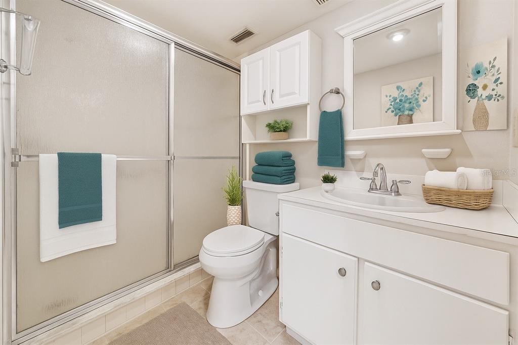 2025 Sylvester Road, Unit N312 Lakeland, FL 33803 - Photo 25 of 35 a bathroom with a sink toilet and shower