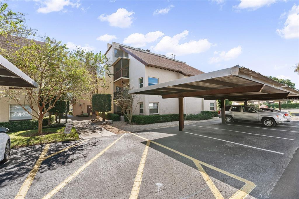 2025 Sylvester Road, Unit N312 Lakeland, FL 33803 - Photo 4 of 35 a view of a house with patio area and porch