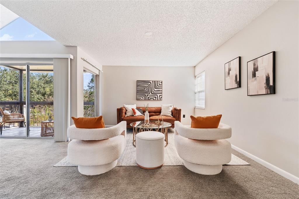 2025 Sylvester Road, Unit N312 Lakeland, FL 33803 - Photo 8 of 35 a living room with furniture and a large window