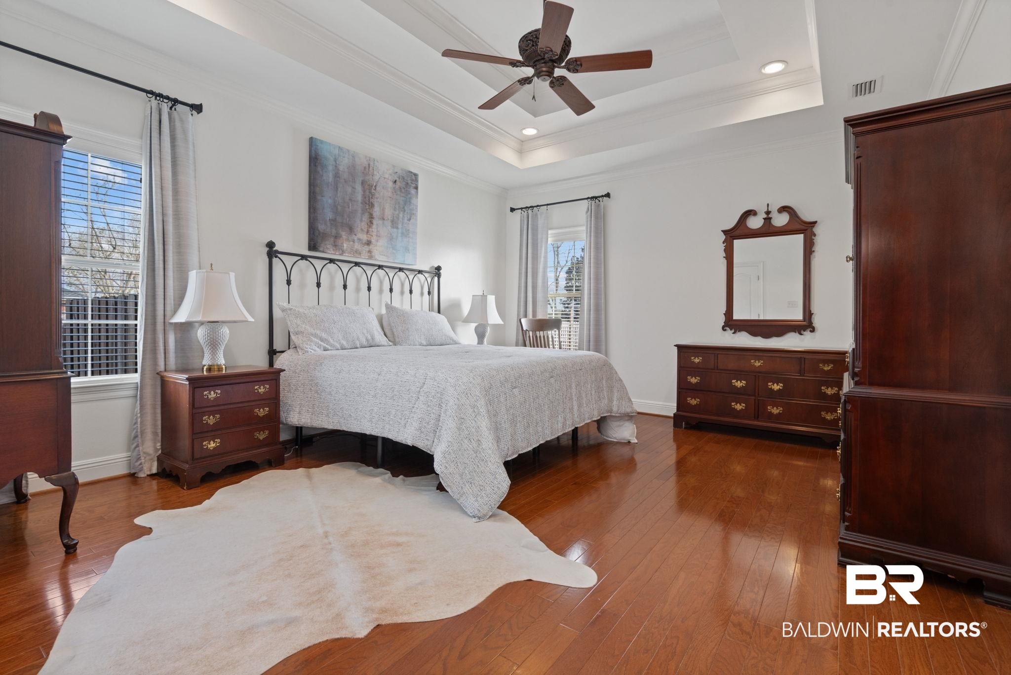 4771 Pecan Ridge East Mobile, AL 36619 - Photo 37 of 48 Bedroom featuring ornamental molding, dark wood-style floors, ceiling fan, recessed lighting, and a tray ceiling