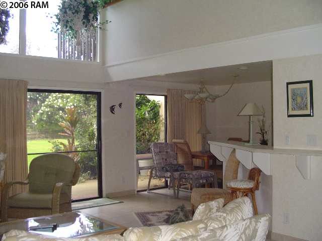 811 South Kihei Road, Unit 1F Kihei, HI 96753 - Photo 11 of 19 a living room with furniture and a large window