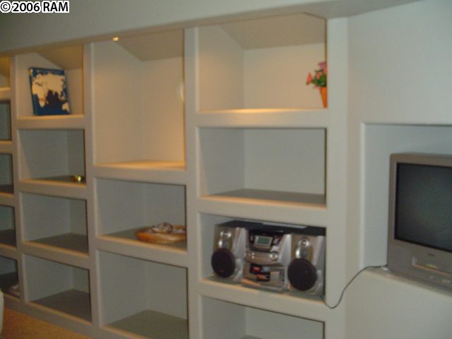 811 South Kihei Road, Unit 1F Kihei, HI 96753 - Photo 13 of 19 a hallway with storage and utility