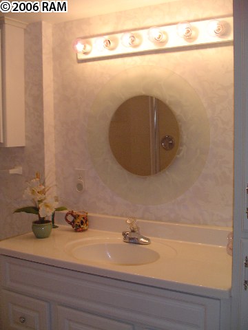 811 South Kihei Road, Unit 1F Kihei, HI 96753 - Photo 18 of 19 a bathroom with a sink and a mirror