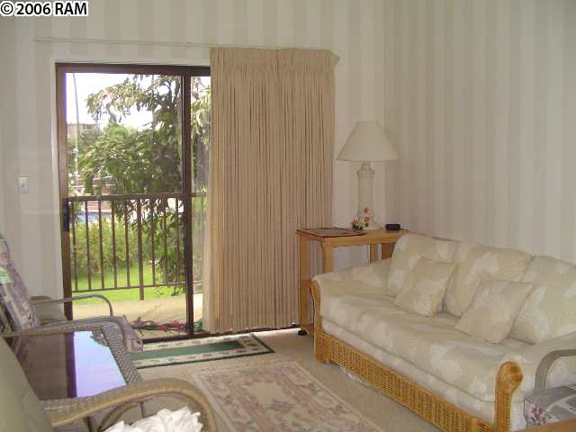 811 South Kihei Road, Unit 1F Kihei, HI 96753 - Photo 19 of 19 a living room with furniture and a floor to ceiling window