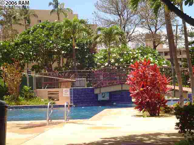811 South Kihei Road, Unit 1F Kihei, HI 96753 - Photo 2 of 19 a view of a chairs and table in the backyard of the house