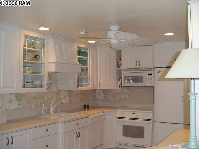 811 South Kihei Road, Unit 1F Kihei, HI 96753 - Photo 6 of 19 a kitchen with appliances cabinets and a sink