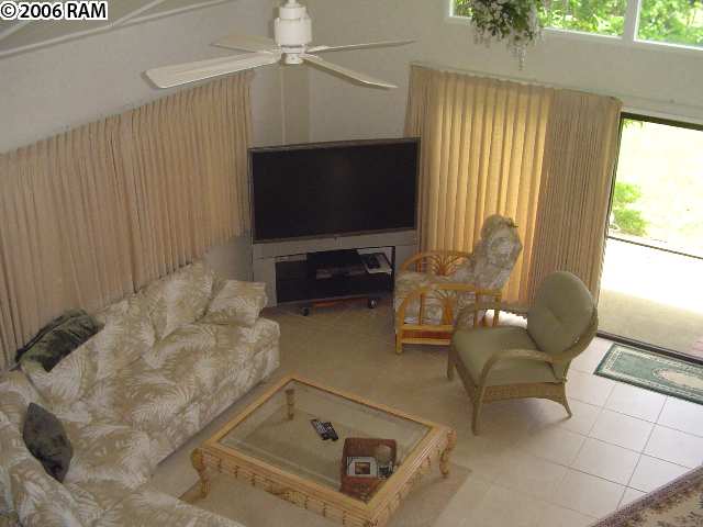 811 South Kihei Road, Unit 1F Kihei, HI 96753 - Photo 10 of 19 a living room with furniture and a flat screen tv