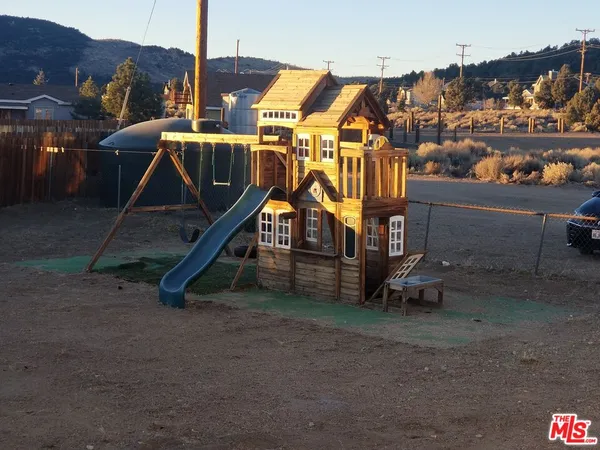 a view of a house with a park