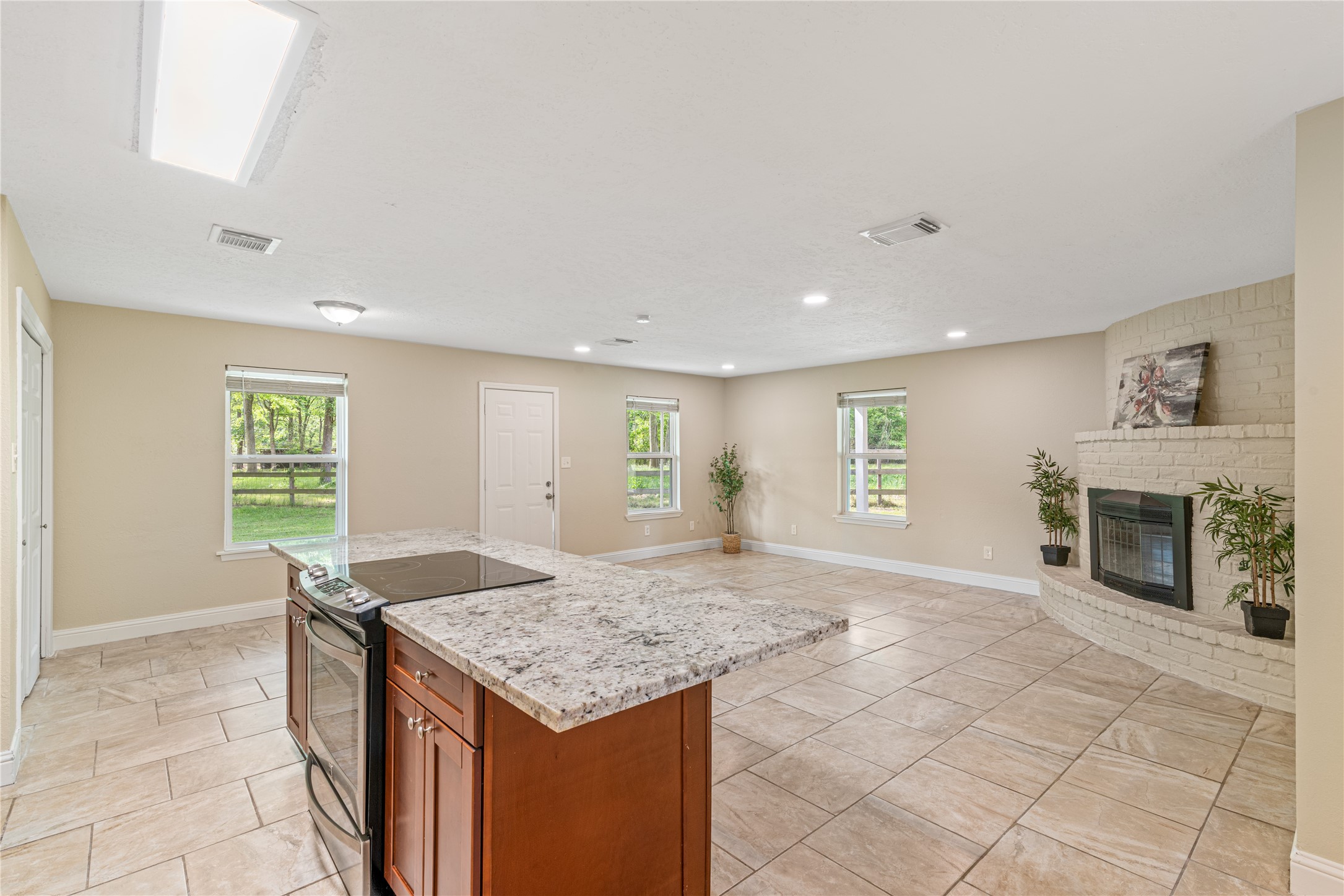 16027 Barbara Lane Magnolia, TX 77355 - Photo 13 of 40 a living room with granite countertop furniture and fireplace