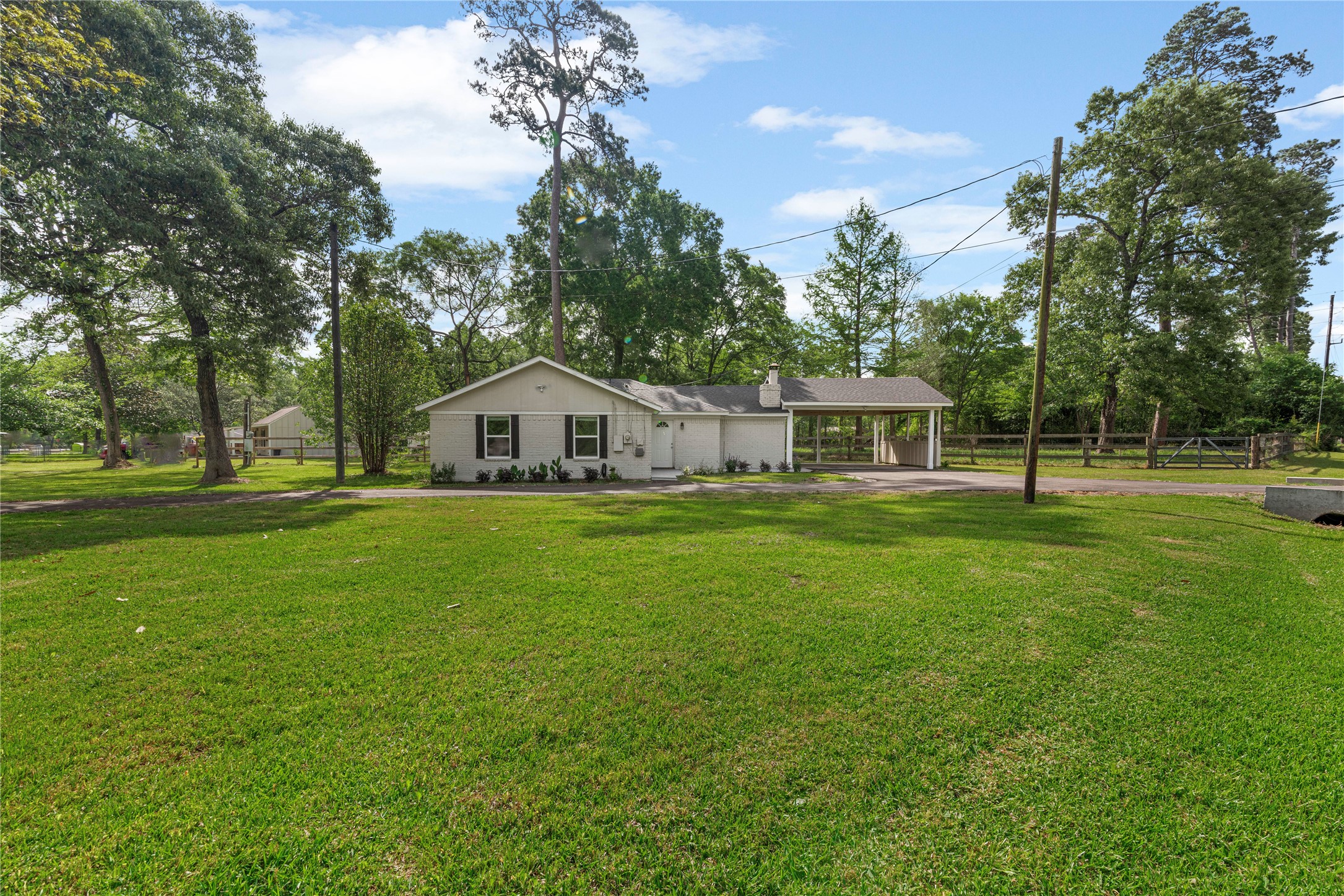 16027 Barbara Lane Magnolia, TX 77355 - Photo 2 of 40 a house view with a outdoor space