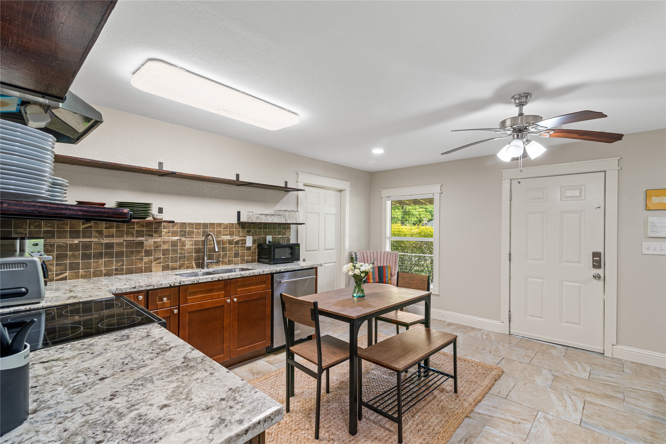 16027 Barbara Lane Magnolia, TX 77355 - Photo 25 of 40 a kitchen with a table and chairs in it