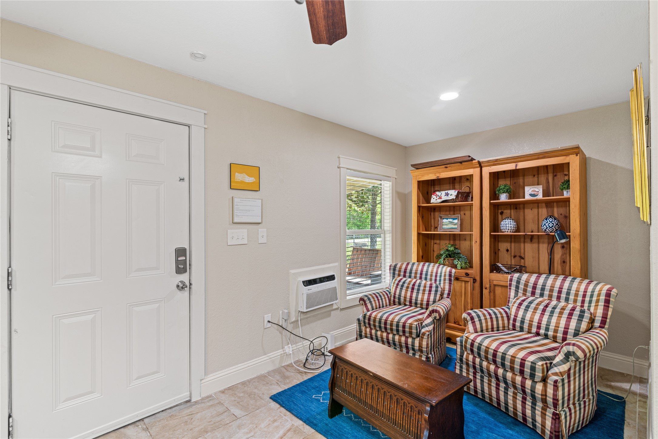 16027 Barbara Lane Magnolia, TX 77355 - Photo 27 of 40 a living room with furniture a rug and a window