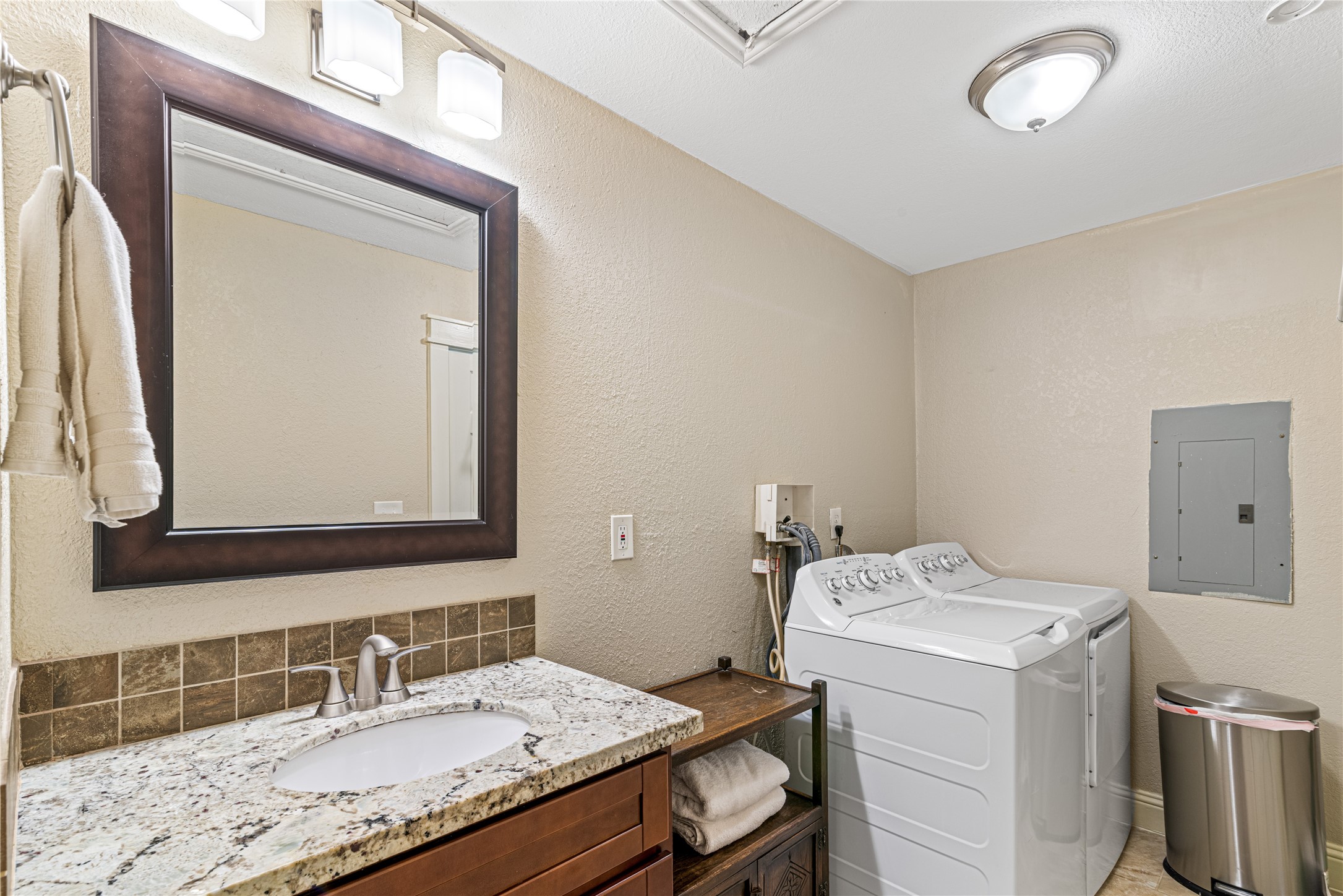 16027 Barbara Lane Magnolia, TX 77355 - Photo 29 of 40 a bathroom with a granite countertop sink and a mirror