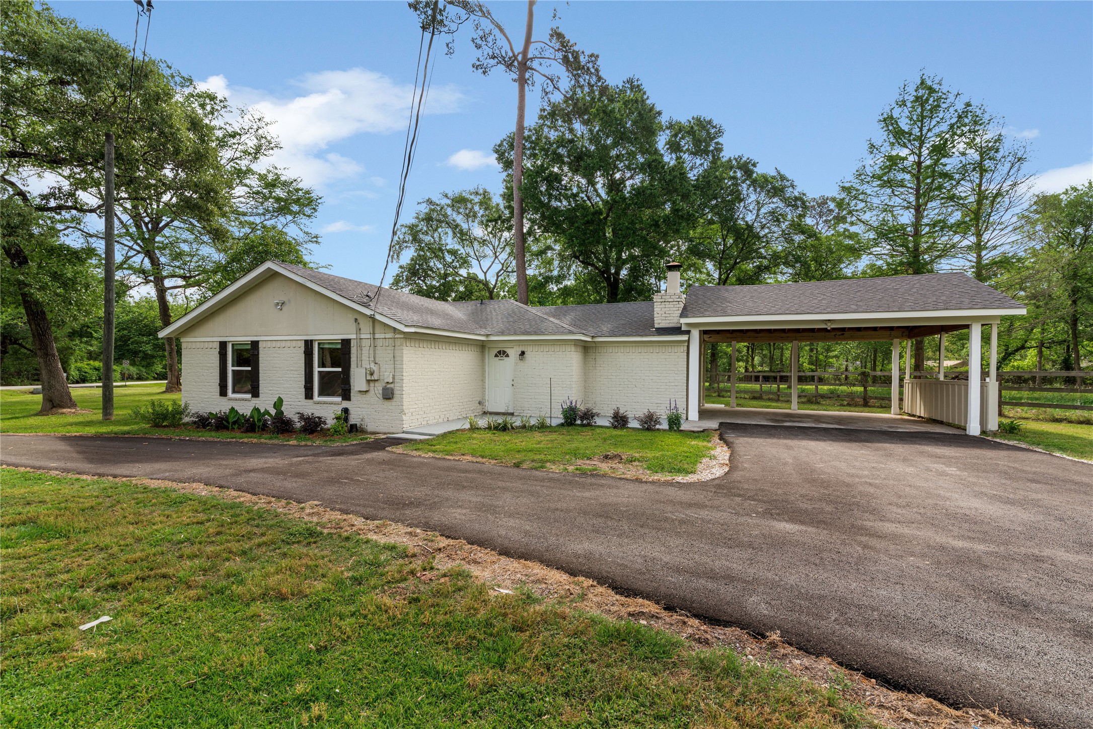 16027 Barbara Lane Magnolia, TX 77355 - Photo 3 of 40 a view of a house with a yard and large tree