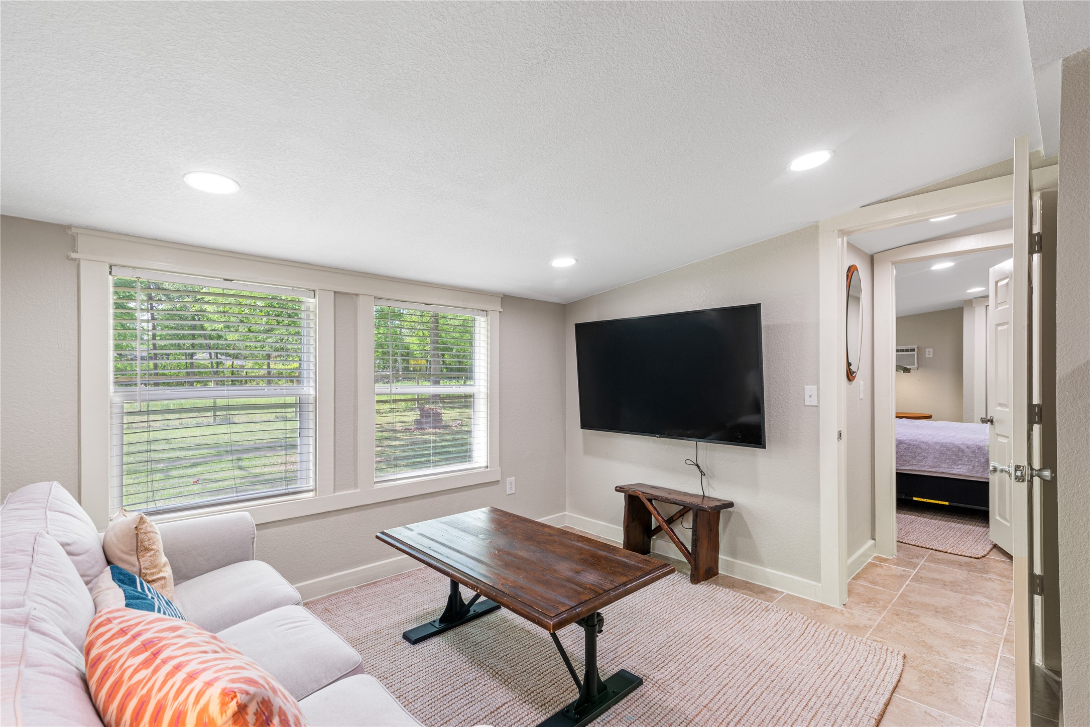 16027 Barbara Lane Magnolia, TX 77355 - Photo 31 of 40 a living room with furniture and a flat screen tv