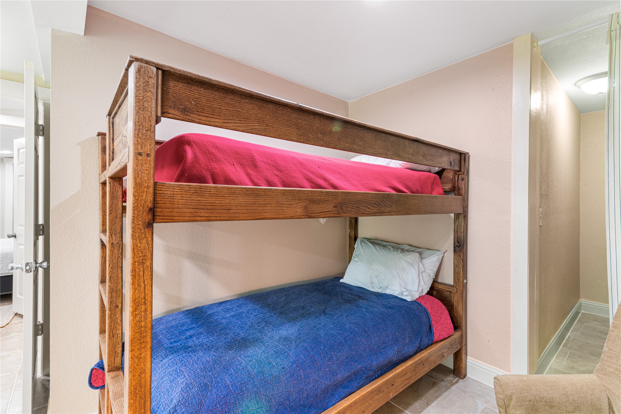 16027 Barbara Lane Magnolia, TX 77355 - Photo 32 of 40 a bed sitting in a bedroom next to a window