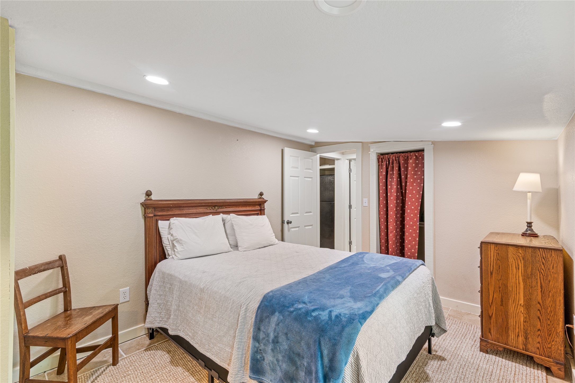 16027 Barbara Lane Magnolia, TX 77355 - Photo 33 of 40 a bed room with a bed and a chair
