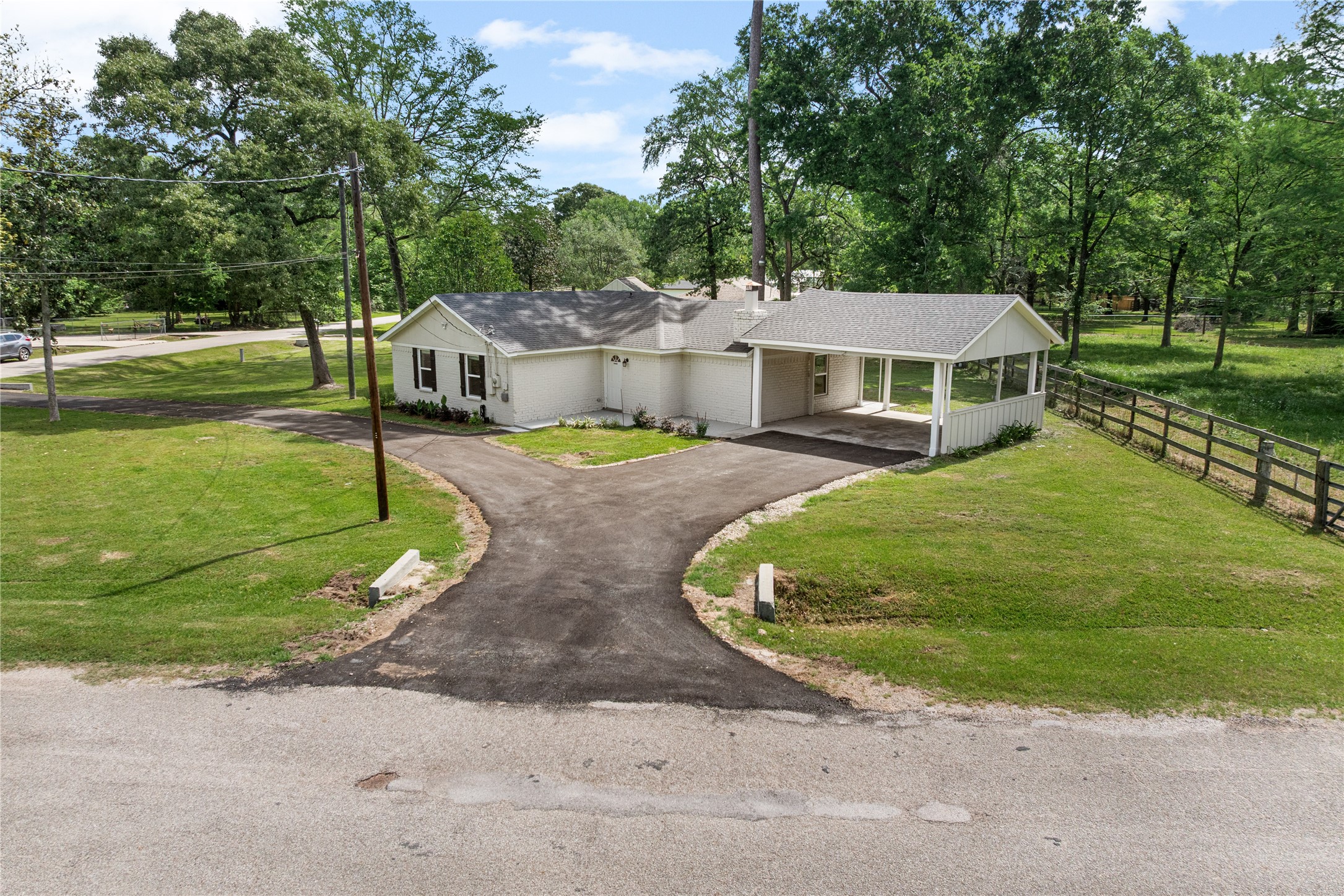 16027 Barbara Lane Magnolia, TX 77355 - Photo 39 of 40 a view of a house with a big yard potted plants and large trees