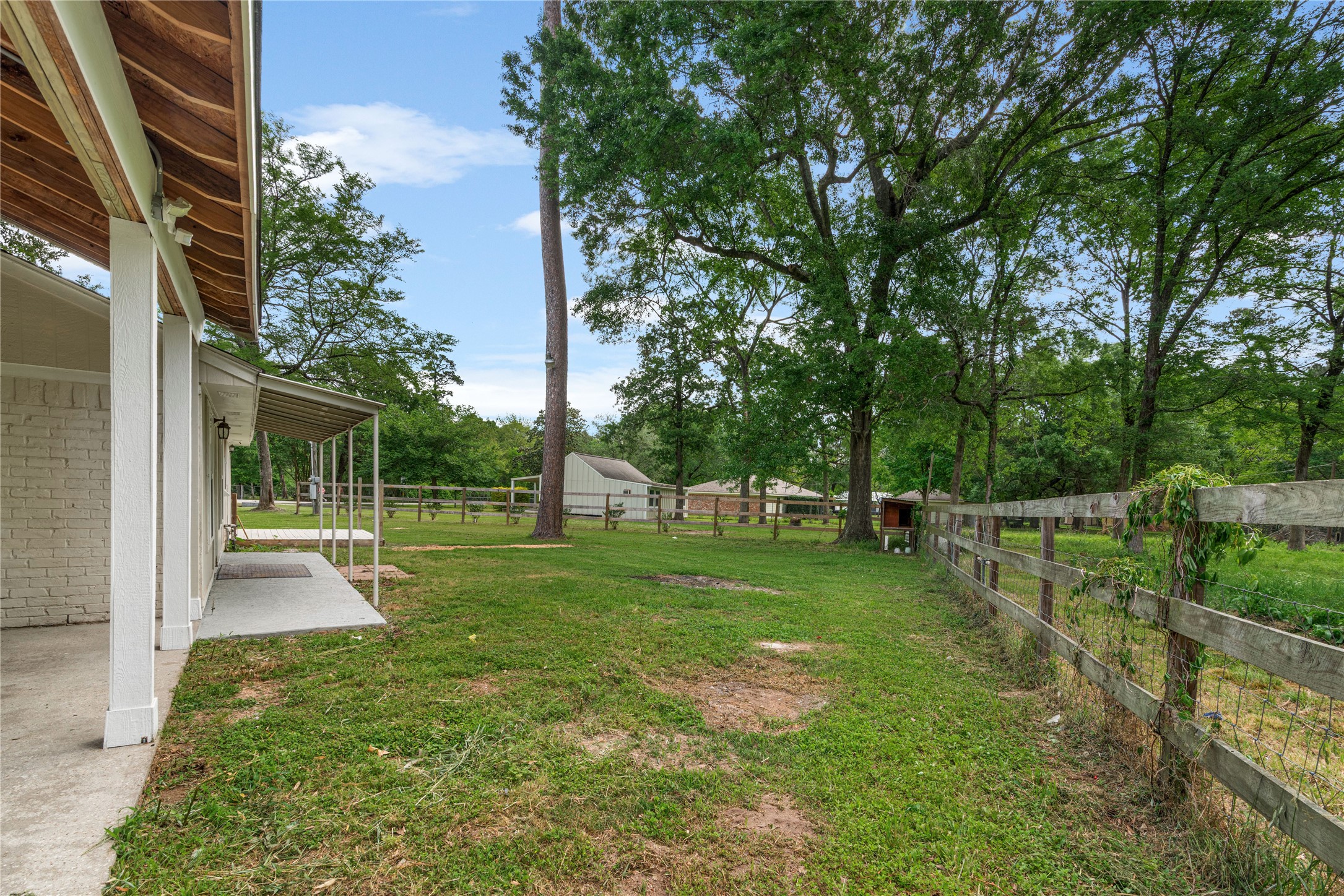 16027 Barbara Lane Magnolia, TX 77355 - Photo 6 of 40 a view of a backyard with slide