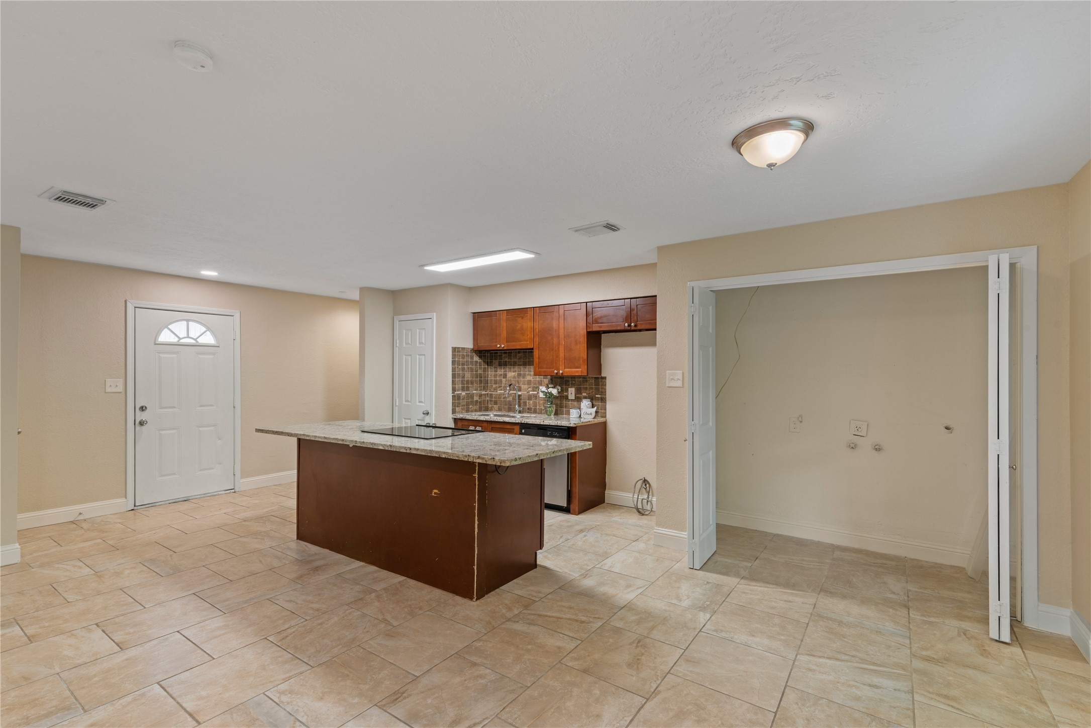 16027 Barbara Lane Magnolia, TX 77355 - Photo 8 of 40 a view of kitchen with granite countertop cabinets and sink