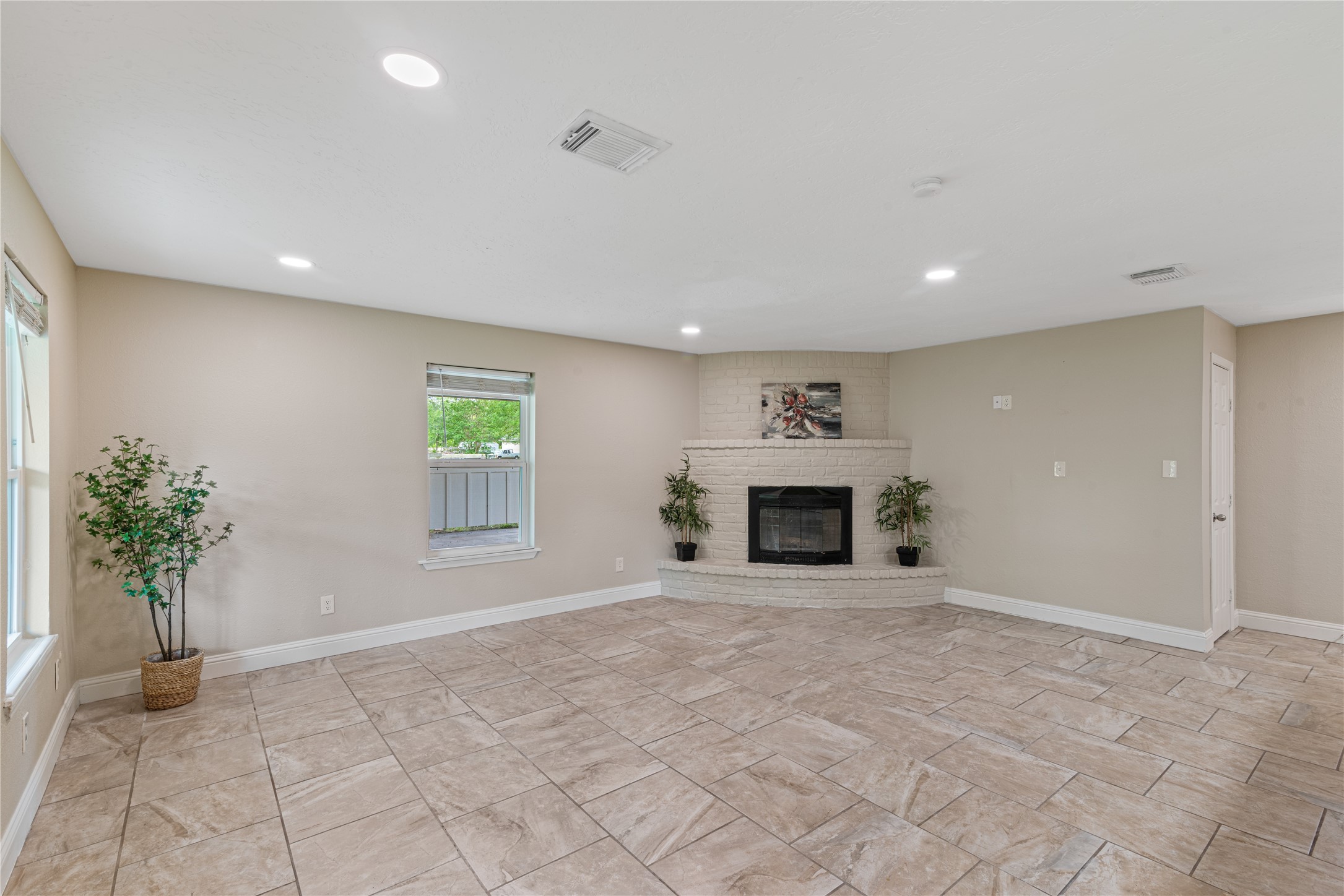 16027 Barbara Lane Magnolia, TX 77355 - Photo 9 of 40 a view of an empty room with a fireplace