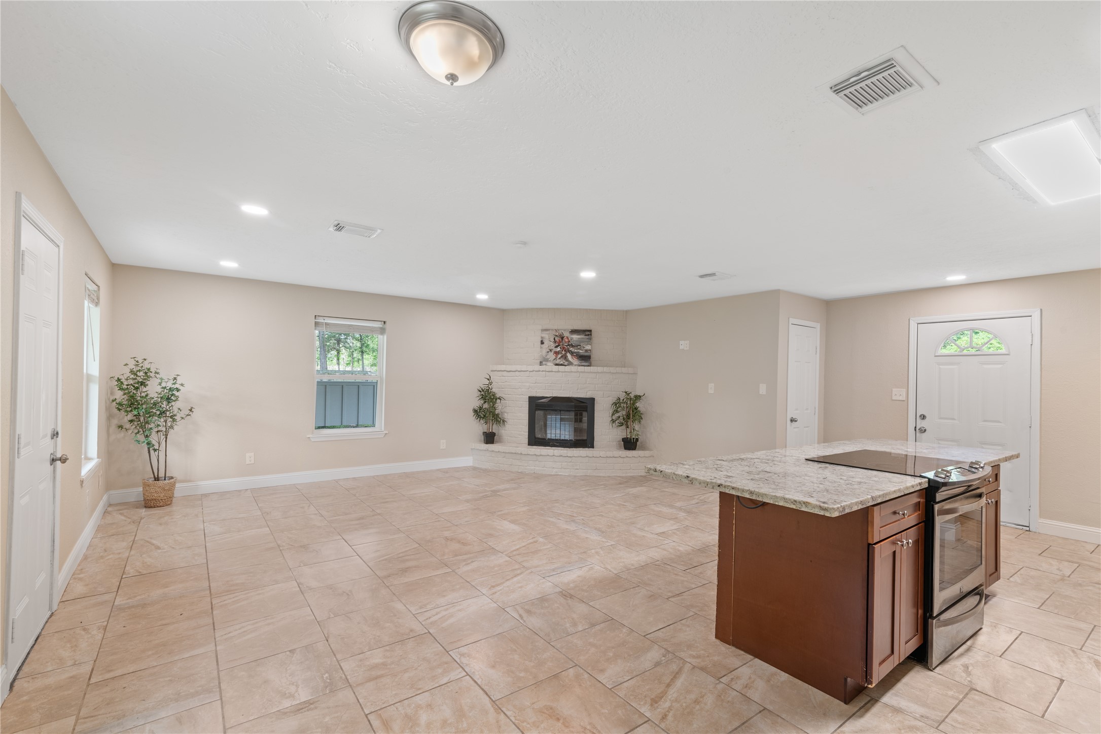 16027 Barbara Lane Magnolia, TX 77355 - Photo 10 of 40 a view of kitchen with granite countertop cabinets and window