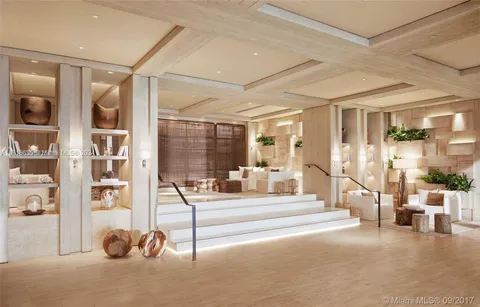 a living room with lots of furniture and a chandelier