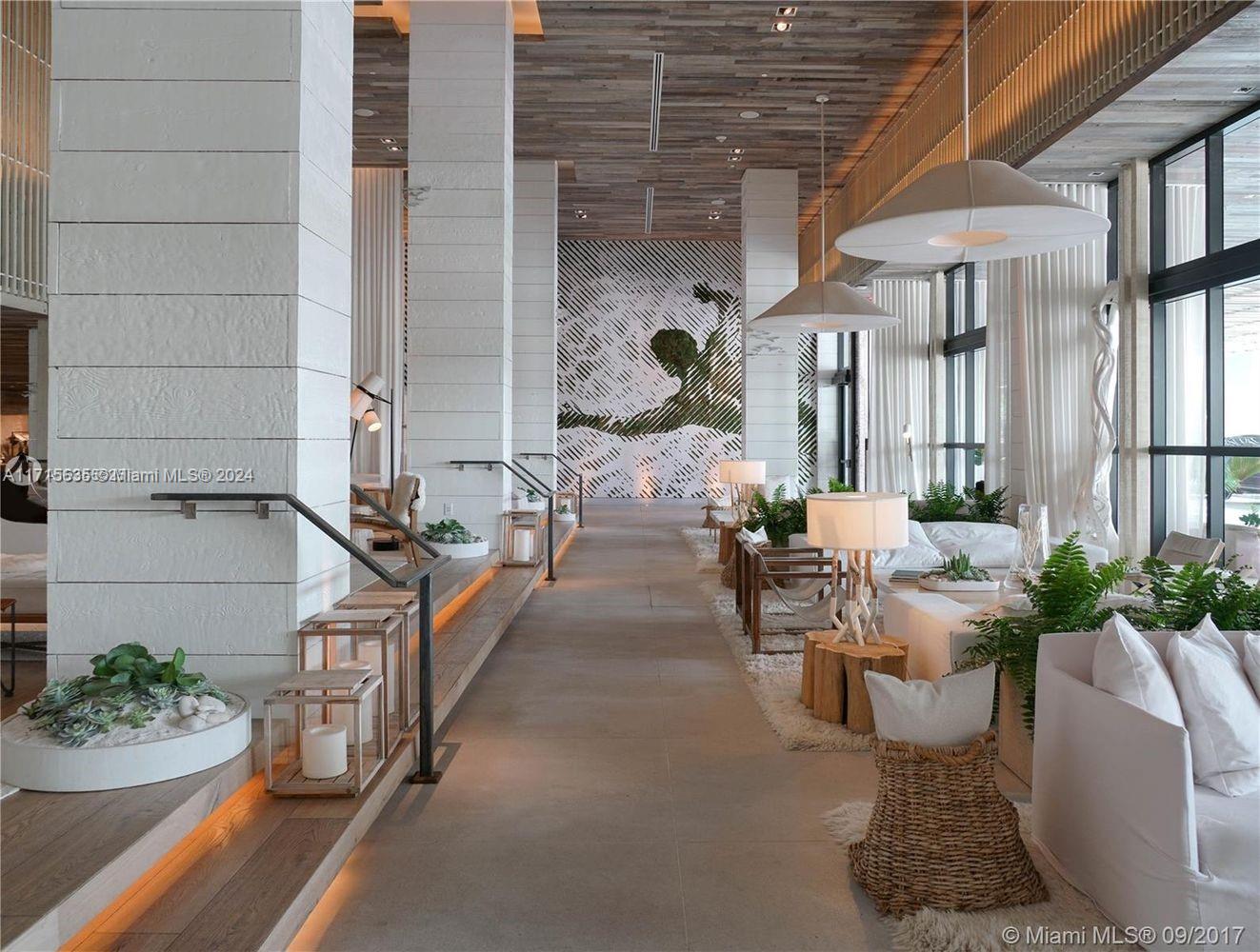 102 24th Street, Unit PH1617 Miami Beach, FL 33139 - Photo 15 of 28 a view of a patio with chairs and potted plants