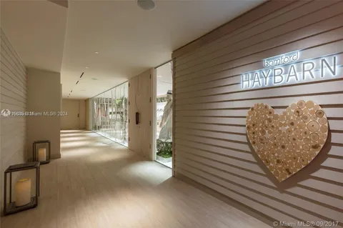 a view of a hallway with stairs