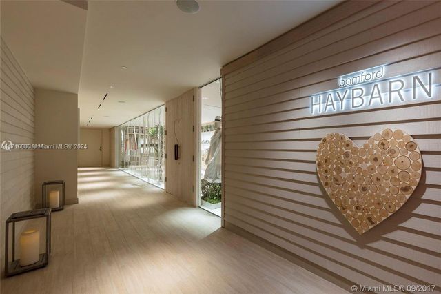 a view of a hallway with stairs