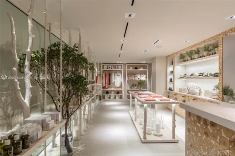 a very nice looking room with a large window and sitting area