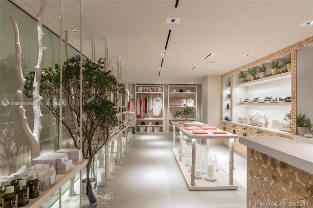 a very nice looking room with a large window and sitting area