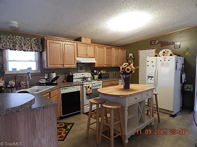 1036 Barn Road Walnut Cove, NC 27052 - Photo 8 of 24 This property comes complete with refrigerator.