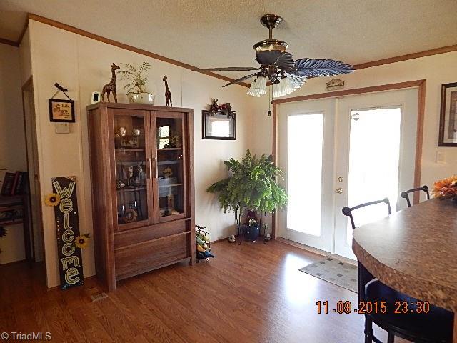 1036 Barn Road Walnut Cove, NC 27052 - Photo 9 of 24 The dining area has beautiful ceiling fan and laminate wood floor.