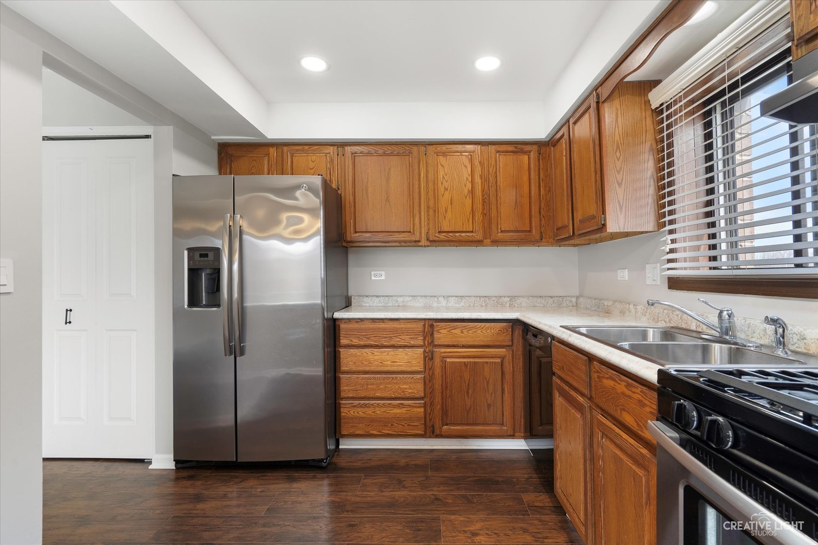 1239 Chalet Road, Unit 200 Naperville, IL 60563 - Photo 6 of 16 a kitchen with stainless steel appliances granite countertop a refrigerator and a sink
