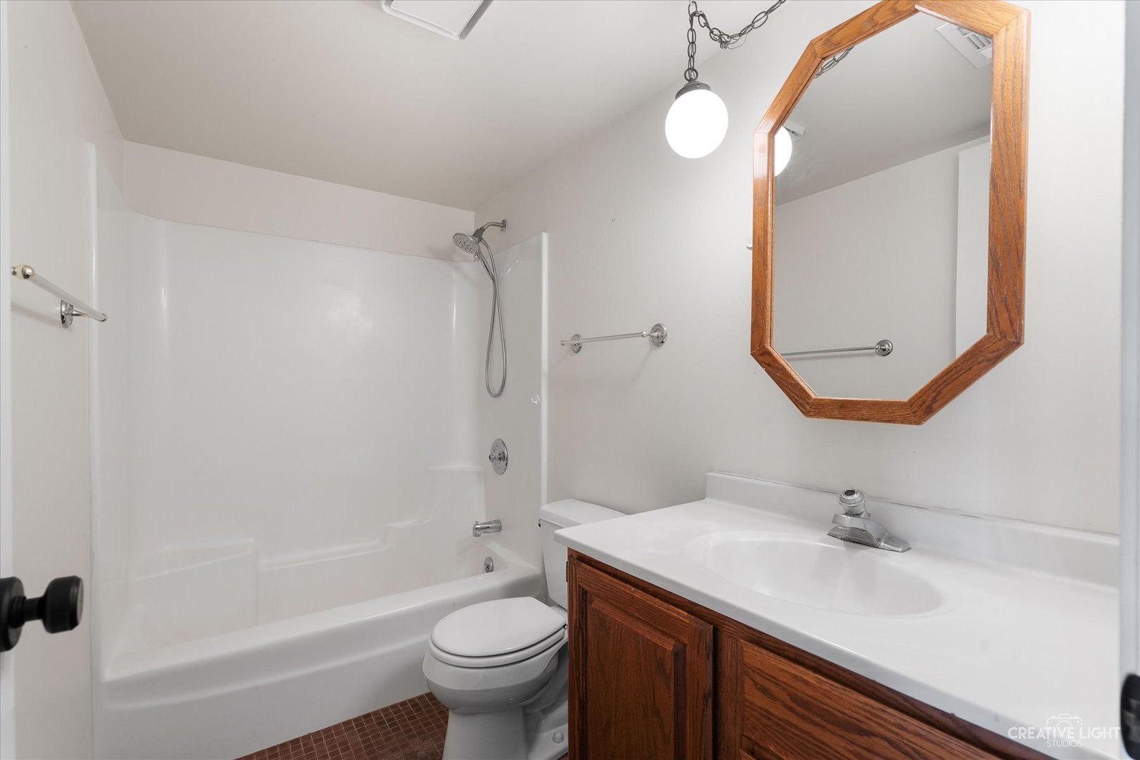 1239 Chalet Road, Unit 200 Naperville, IL 60563 - Photo 9 of 16 a bathroom with a sink a toilet and shower