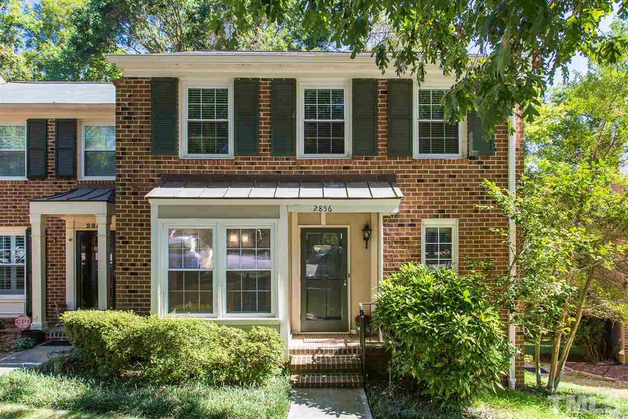 2856 Wycliff Road Raleigh, NC 27607 - Photo 1 of 29 front view of a brick house with a large windows