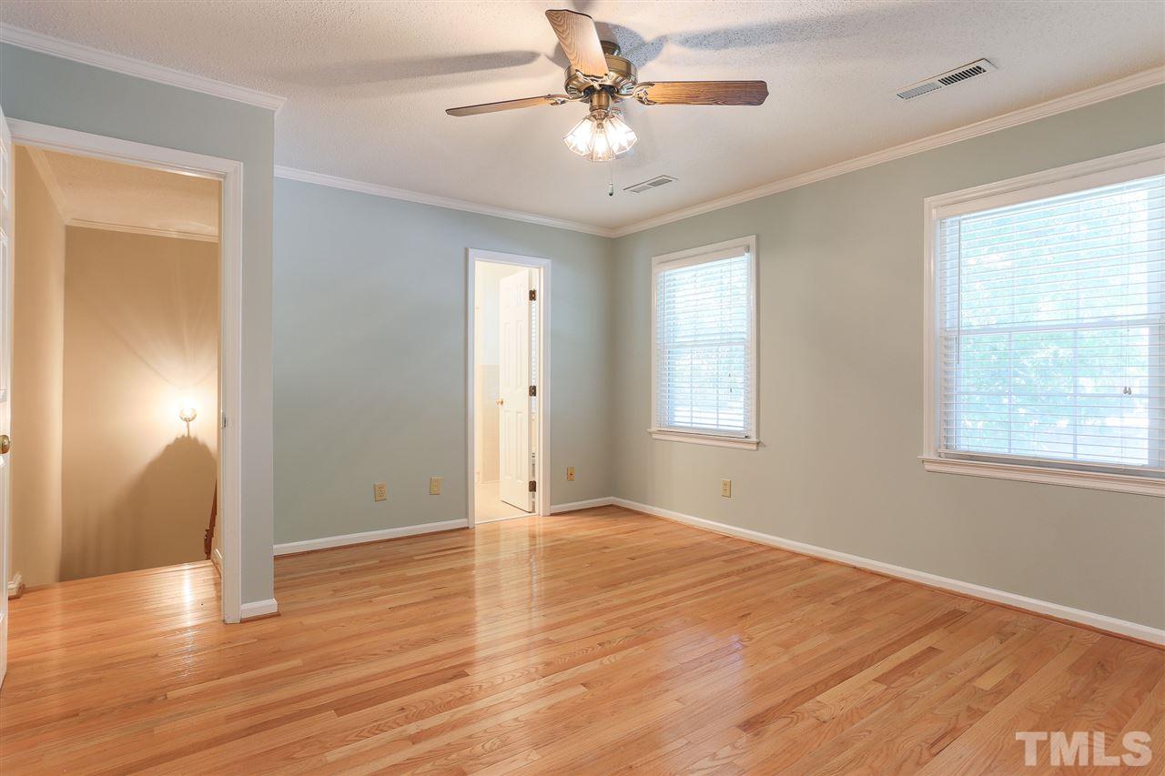 2856 Wycliff Road Raleigh, NC 27607 - Photo 17 of 29 a view of an empty room with window and wooden floor