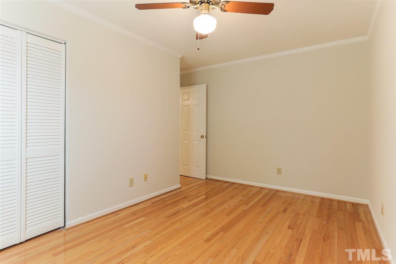 2856 Wycliff Road Raleigh, NC 27607 - Photo 21 of 29 a view of a room with wooden floor and fan