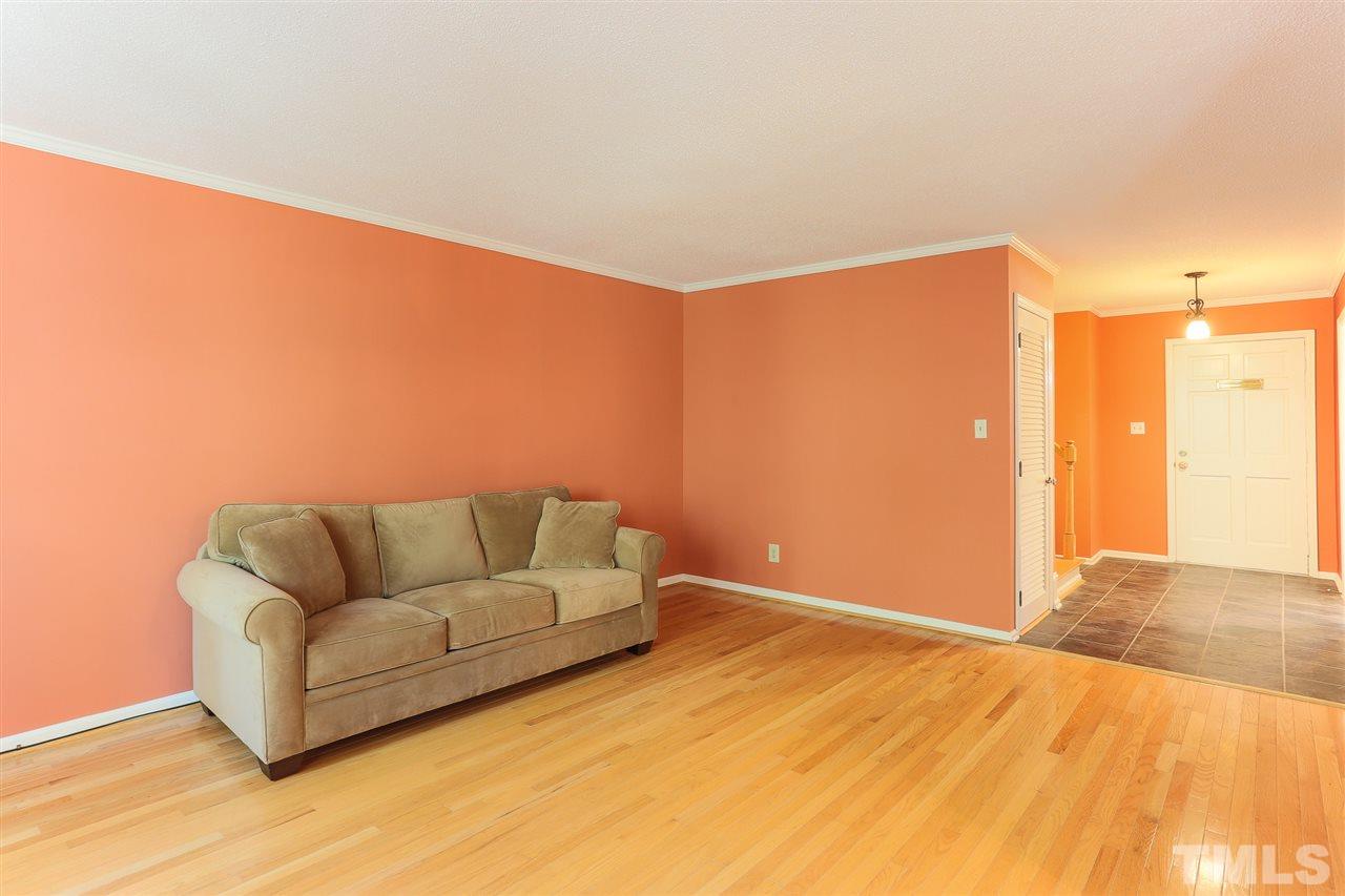 2856 Wycliff Road Raleigh, NC 27607 - Photo 9 of 29 a living room with furniture and a wooden floor