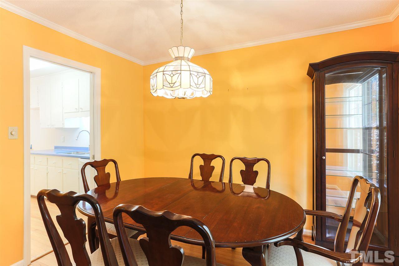 2856 Wycliff Road Raleigh, NC 27607 - Photo 10 of 29 a view of a dining room with furniture and chandelier
