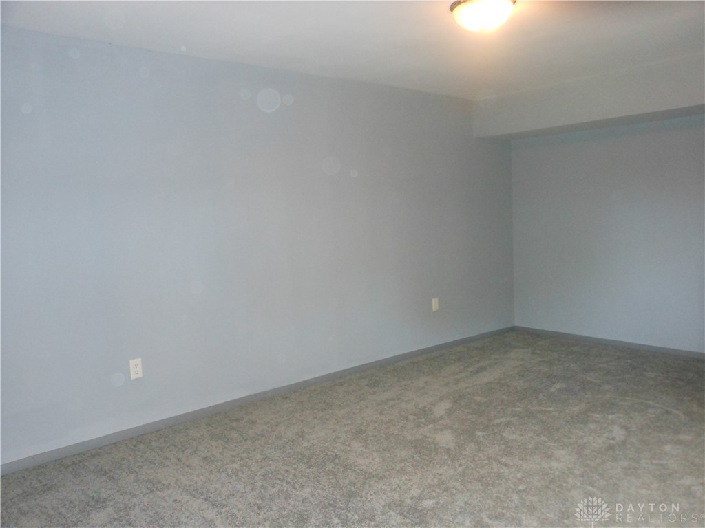 143 West Emerick Road West Milton, OH 45383 - Photo 14 of 37 This spacious room offers comfort and versatility, perfect for crafting your ideal living space.