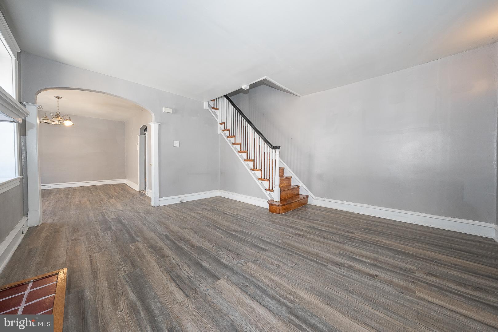 169 Overhill Road Upper Darby, PA 19082 - Photo 14 of 69 a view of an empty room with wooden floor and stairs