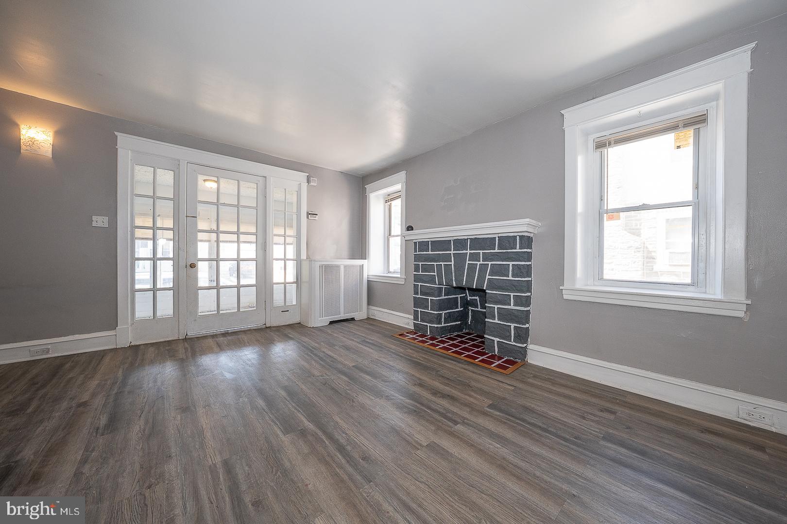 169 Overhill Road Upper Darby, PA 19082 - Photo 15 of 69 an empty room with wooden floor and windows